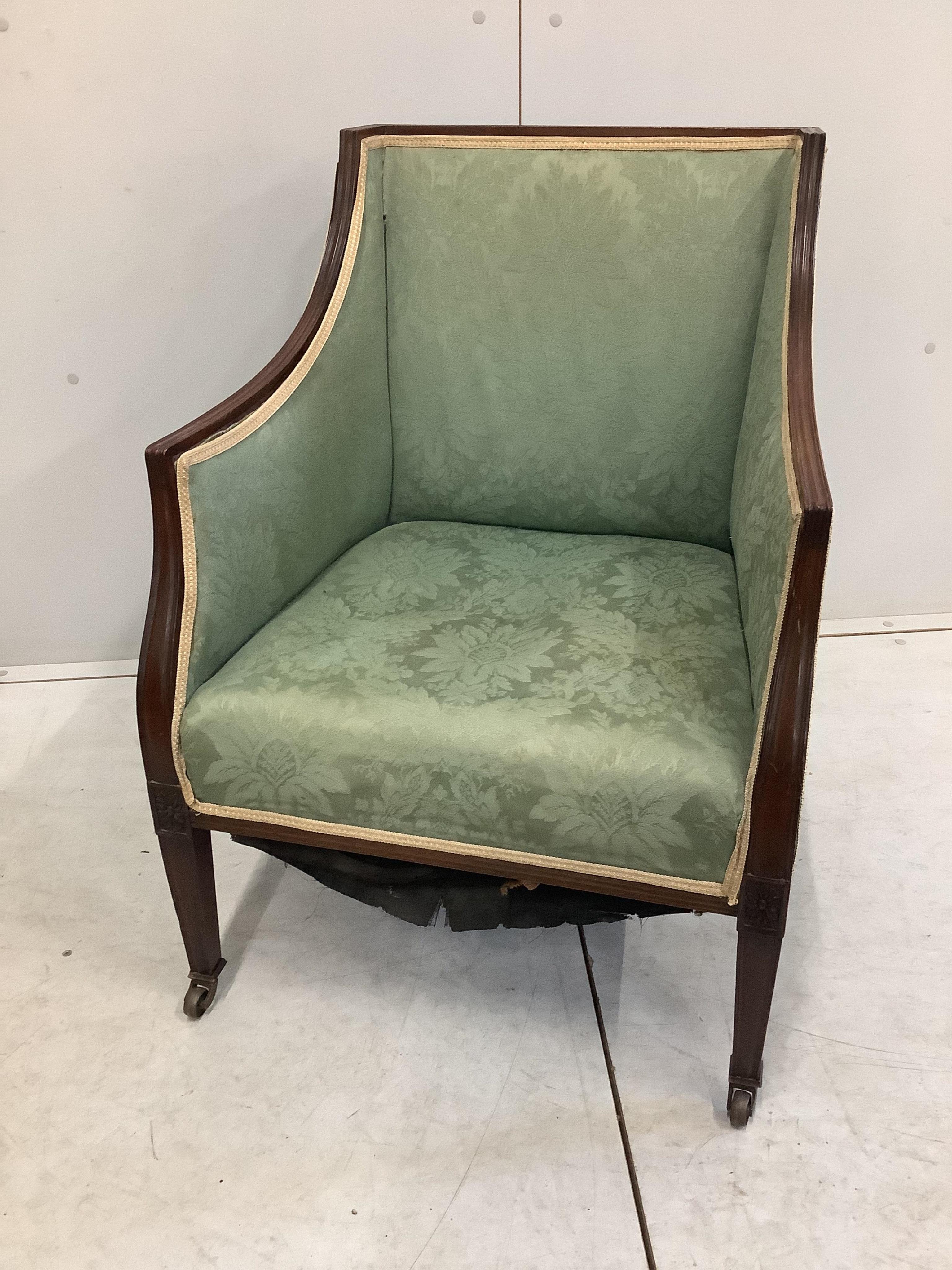 A pair of Edwardian mahogany armchairs, width 59cm, depth 55cm, height 79cm. Condition - fair, upholstery poor